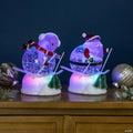 LED Lighted Color Changing Skiing Santa and Snowman Acrylic Christmas Snow Globes - 7.25" - Set of 2
