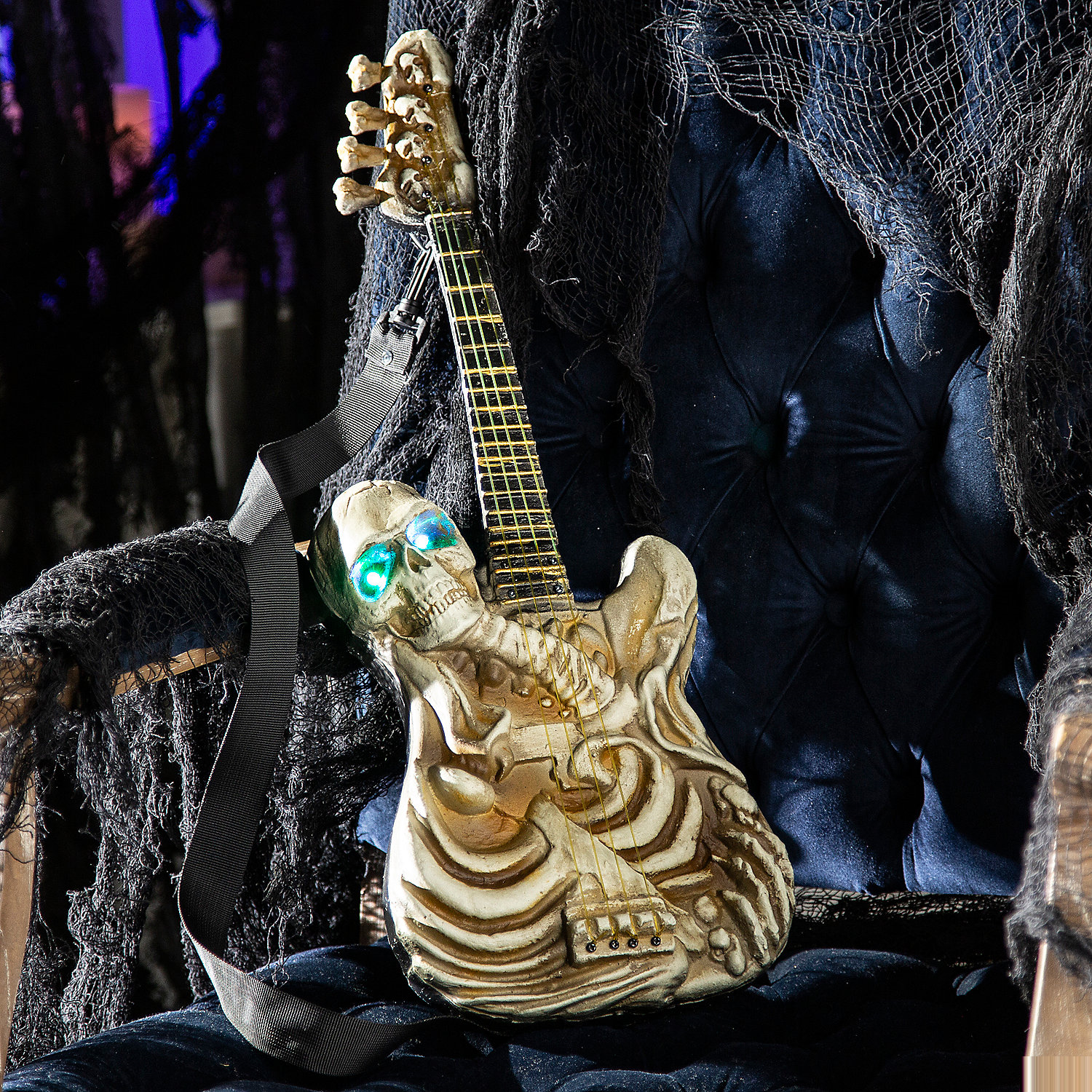 Light-Up Ukulele-Shaped Plastic Skeleton Halloween Decoration, 2 Ft.